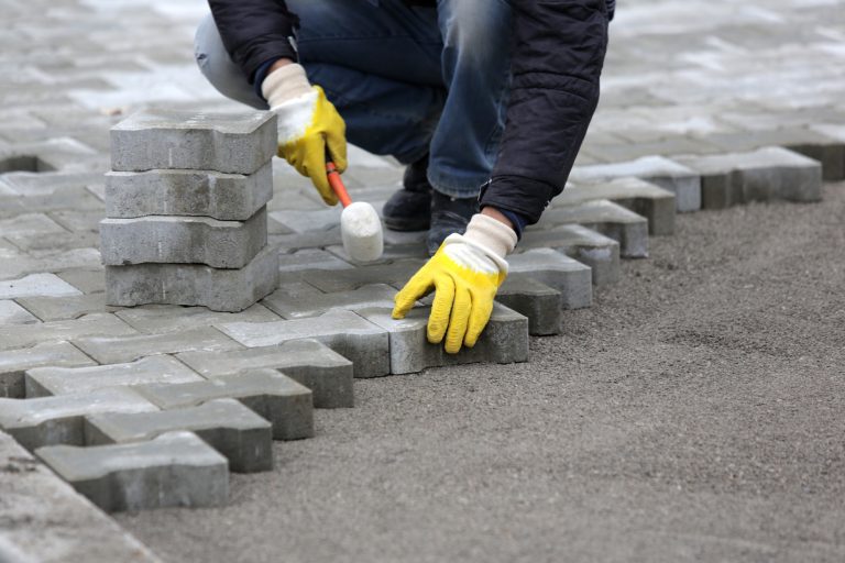 laying pavers in backyard